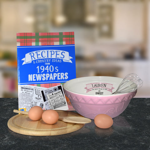 Pink mixing bowl and 1940 recipe book
